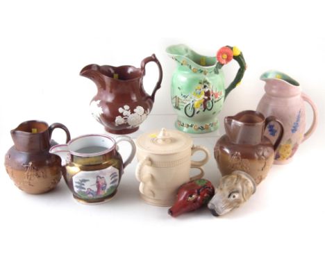 19th century and later pottery to include a Davenport lidded jug, two Stone ware hunting jugs, two styrup cups in the forms o