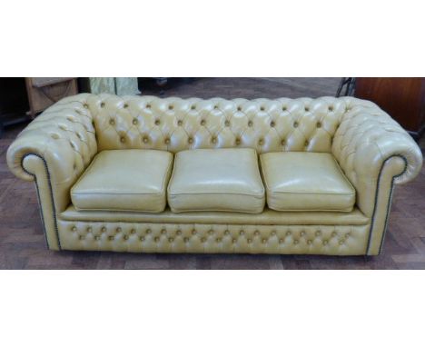 Light tan leather Chesterfield three seater settee.