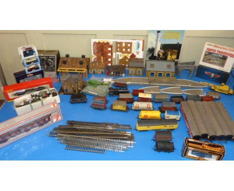 A quantity of Hornby/ Triang OO carriages and freight wagons, a quantity of track, Lima (M.25264) carriage, Buffers, Mainline