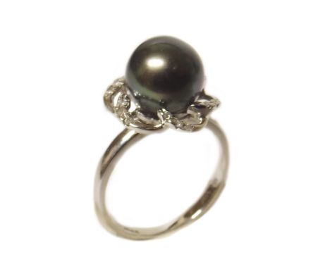 18ct gold Tahitian pearl set ring with diamond chips Condition reports are not available for our Interiors Sales.