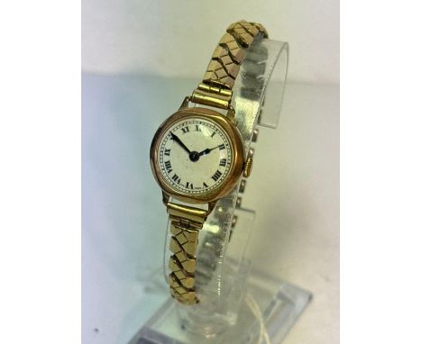 A ladies wrist watch 9ct with expandable strap