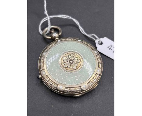 Novelty 1920’s silver compact designed as a pocket watch with enamelled decoration and hinged to reveal a mirror and powder p