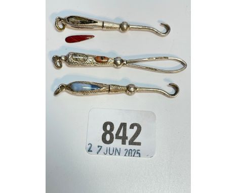 A group of three small button hooks inset with hard stones 2 inches long