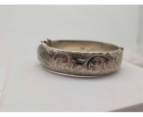 A silver hinged bangle 25 gms