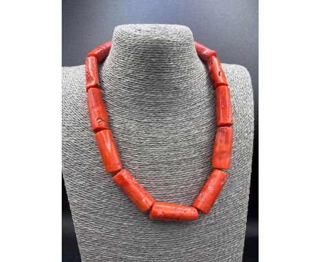 A large bamboo coral bead necklace