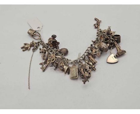 A silver charm bracelet 72 gms