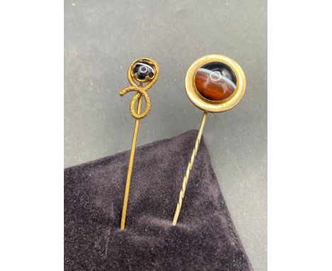 A antique agate topped stick pin and one other