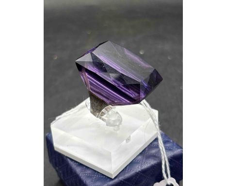 A large silver flashy purple stone dress ring size Q