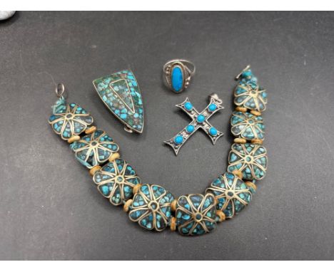 A Navajo Indian tribal bracelet and brooch plus turquoise cross and ring  