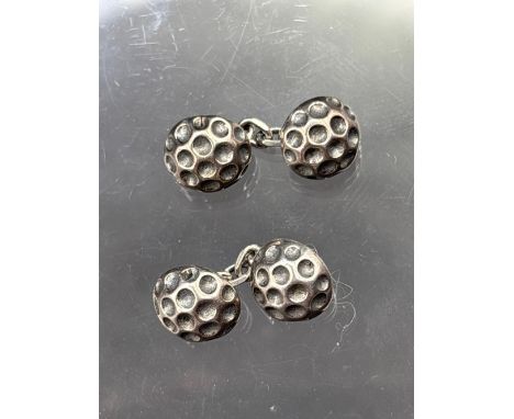 A pair of golf ball cufflinks set in silver - 7 gms