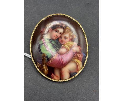 Antique Victorian gilt brooch set with a porcelain plaque of the Madonna and child