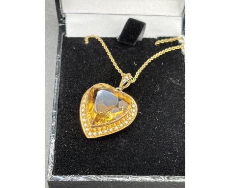 A EDWARDIAN GOLD HEART SHAPED PENDANT WITH HEART SHAPED CITRINE SURROUND WITH PEARLS CHESTER 1909 BY G E WALTON AND Co WITH 9