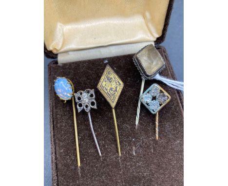 Five assorted stick pins