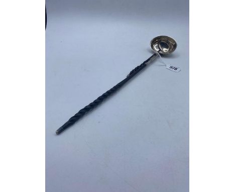 An oval silver bowl toddy ladle with whale bone handle and another damaged example
