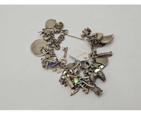 A silver charm bracelet 72 gms