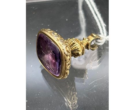 Antique gold cased fob seal set with an amethyst with a lion intaglio 