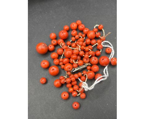 A coral bead necklace 19 inch requires re-string