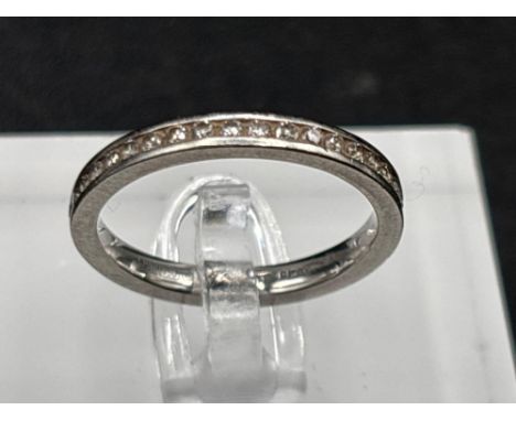 A platinum full cut diamond eternity ring, size L, 3.2 g.