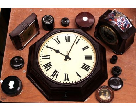 A collection of Bakelite items to include; A G.P.O octagonal wall clock with G.R motif, a British Thomson Houston Co Ltd cone