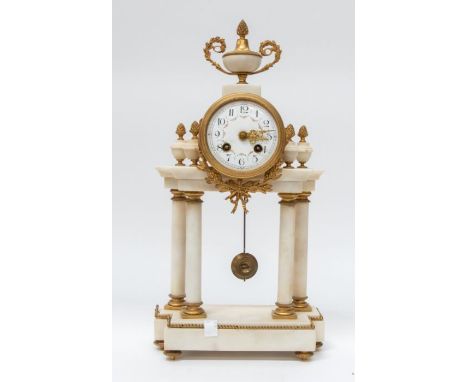 A late 19th century French white marble and gilt 8-day mantel clock with Arabic numerals and column supports.