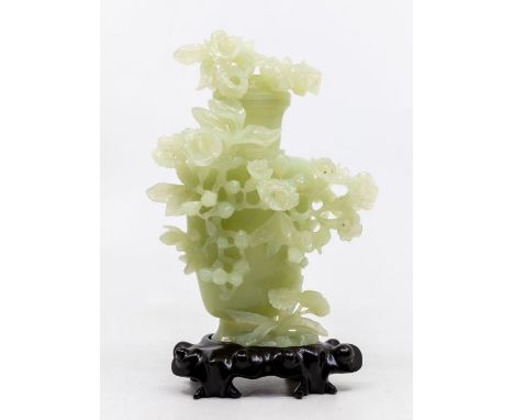 A Modern Chinese pale jade carved vase and cover, carved with flowers, 18cm high, with carved base, in original box&nbsp;