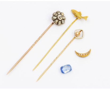 Three gold stick pins, to include an 18ct gold gold fish, weight approx 2.2gms along with a topaz set cluster pin in silver a