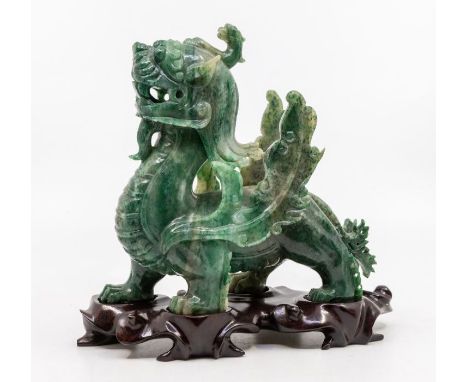 A Modern Chinese spinach green jade carved figure of a dragon, 17cm high overall, with stand, original box&nbsp;&nbsp;