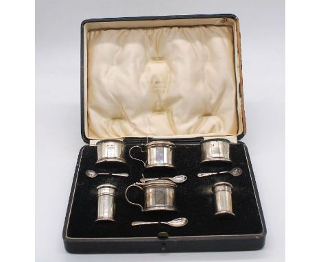 A collection of part silver condiment sets to include; a matching mustard pot, two salt cellars, pepperette and two condiment
