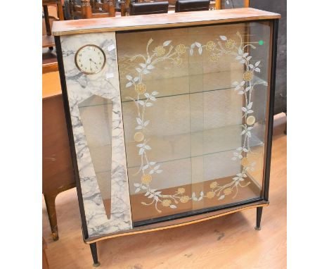 A 1950's mahogany cabinet with Smith inserted clock detail glass doors