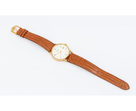 A Rotary 9ct gold watch, comprising a round silvered dial with applied gilt baton markers, black Arabic markers, date apertur
