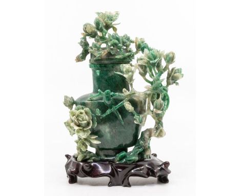 A Chinese spinach green jade vase and cover, carved with roses, birds and foliage, detachable cover, 21cm high overall, with 