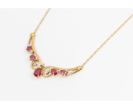 A ruby and diamond 9ct gold necklace, comprising a crescent front with gold scrolled work set with pearl cut rubies and small