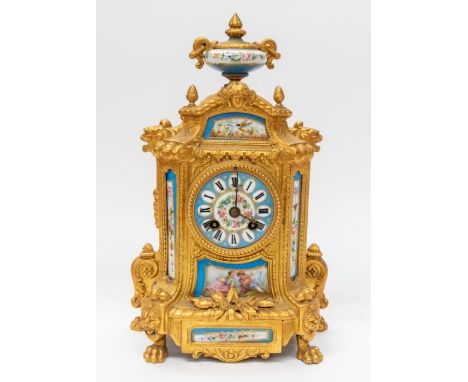 A late 19th century, French, gilt and porcelain, 8-day mantel clock with Roman numerals.