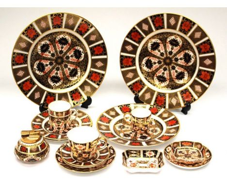 A collection of Royal Crown Derby items including; a 1128 Imari desk lighter, 10.5" approx dinner plates, first and second qu