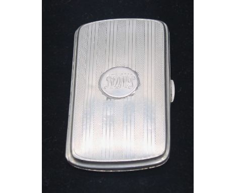 A George VI silver cigarette case, engine turned with stripped decoration, central circular cartouche engraved with initials,