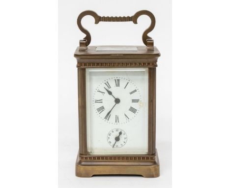 A 19th Century brass metal carriage clock, 3" x 2 1/4" white enamel dial with Roman numerals, subsidiary alarm dial, Single t