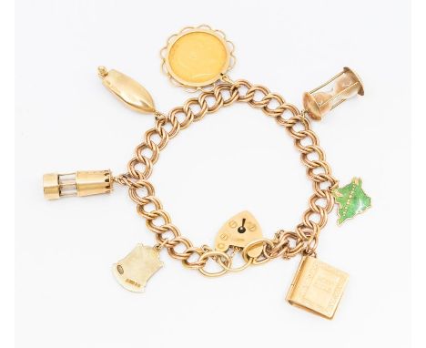 A 9ct gold fancy link charm bracelet suspending seven various 9ct gold charms including a Edward VII half sovereign dated 190