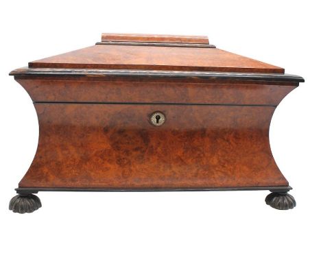 A large Victorian burr walnut tea caddy with bun feet and two walnut tea compartments and mixing glass