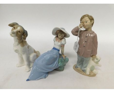 Three Nao figures of children and a dog