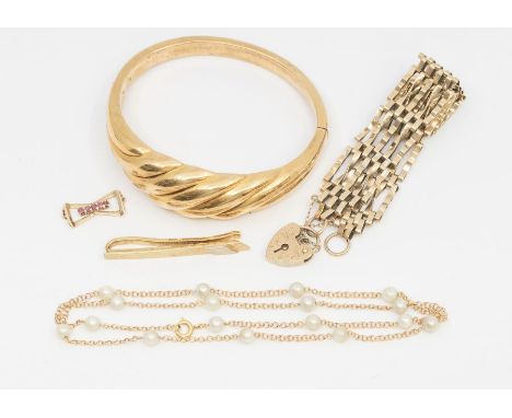 A 14ct gold tie pin, weight approx 5.6gms, along with a 9ct gold gate bracelet, weight approx 11.6gms, a 9ct gold ruby set pe