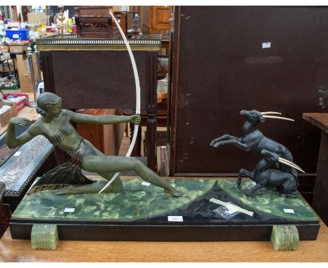 A large circa 1930s marble and black slate table garniture, figure of Diana hunting bucks