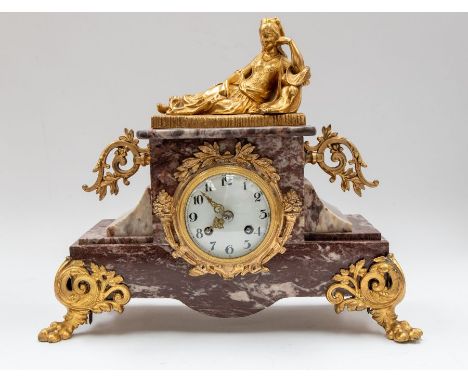 A 19th Century French marble mantle clock, with gilt detail scrolls and a reclining lady