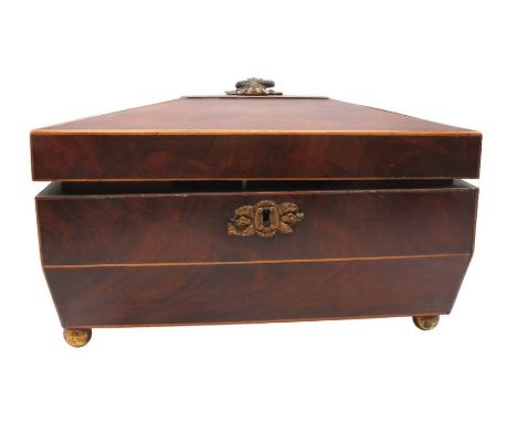A 19th century Victorian mahogany sarcophagus tea caddy with two tea compartments and mixing glass