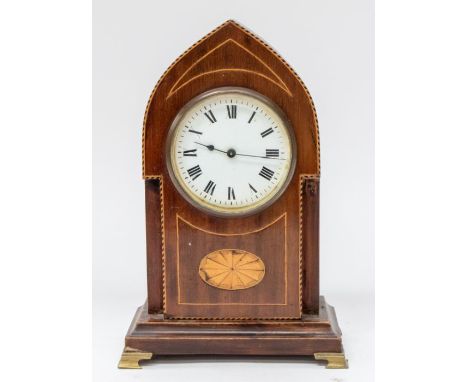 An early 20th century mantel clock of mahogany with inlay and with Roman numerals.