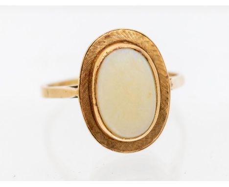 An opal and 9ct rose gold ring, comprising an oval opal to the centre approx 8 x 12mm, (abraded) rub-over set to an oval text