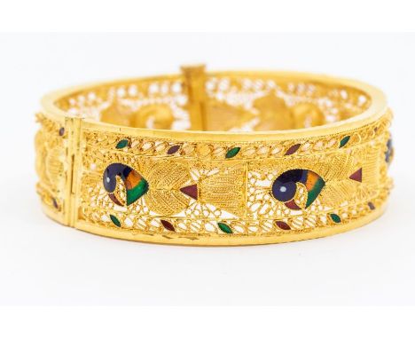 A 22carat gold and enamel Indian hinged bangle, filigree work with enamel peacock decoration, width approx 20mm, internal dia