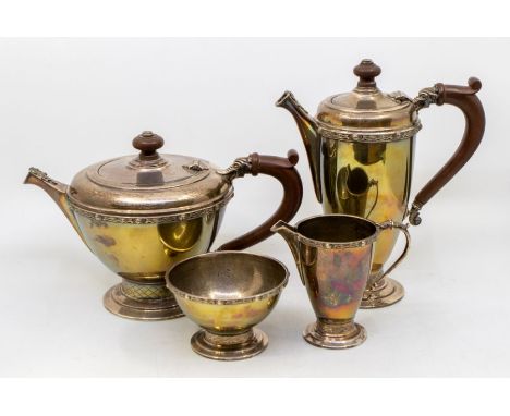 A Modern Celtic Revival four piece silver tea set comprising tea and coffee pot, milk jug and sugar bowl, with Celtic band de