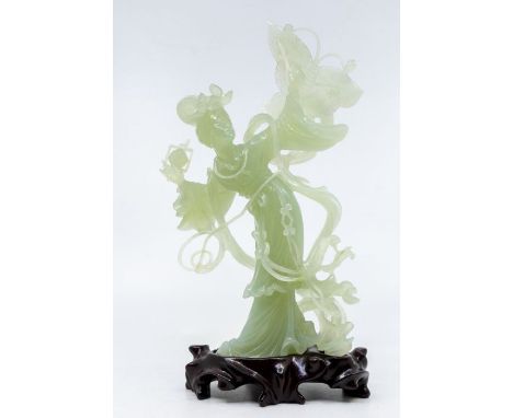 A Chinese pale jade figure of Geisha holding a butterfly kite, approx 25cm high, with carved hardwood stand, boxed&nbsp;