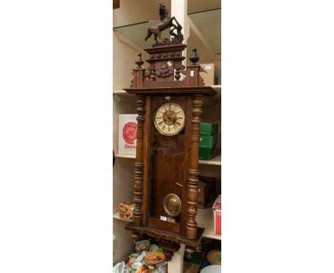 Vienna wall clock with two train 8 day spring driven movement chiming on a gong. With two piece dial movement stamped F M wit