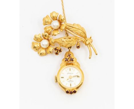 A ladies 9ct gold brooch lapel watch, comprising a pear and garnet set spray brooch, width approx 35mm, suspending a Rotary w